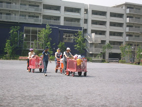 The kids at the local daycare in Minato getting carted out for playtime
