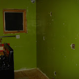 The kitchen wall, with the gas line capped, and all cabinets and wiring in the walls removed