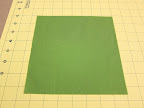 Cut a second piece of fabric to the size of the finished block, plus seam allowance.