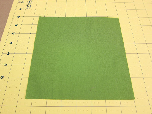 Cut a second piece of fabric to the size of the finished block, plus seam allowance.