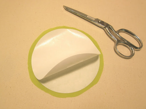 Place second freezer paper circle shiny side UP on top of fused circle. Use a couple small pieces of double-sided tape to temporarily tack the two together.