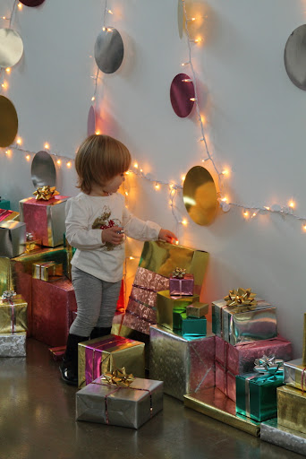 A helpful elf arranging our presents just so.