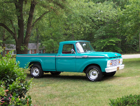 1963 F100 Styleside. Belongs to Chris Frasca of
Raleigh, N.C. All stock except for the wheels, tires, and seat cover. Original 223 motor (rebuilt), 3 speed standard.