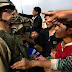 20080424_ea6fa1a7b691ce09ccebqH4iw17dPBTQ.jpg, Task Force 2-69 Armor, 3rd Brigade Combat Team, 3rd Infantry Division from Fort Benning Georgia: Spc. Richard Edwards tries to keep Iraqi civilians back after another soldier began throwing candy from a vehicle. Adults and children swarmed the vehicle trying to get a piece of American candy. Photo by: David Leeson/The Dallas Morning News, IRAQ－AP Photo