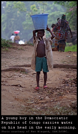 DRC boy carrying water