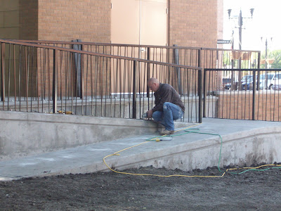 A worker installs railing around the new wheel chair ramp at Washington's Central Park Bandstand (KCII NEWS) A worker installs railing around the new wheel chair ramp at Washington's Central Park Bandstand (KCII NEWS)