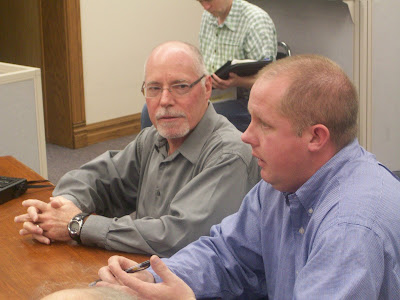 Kalona City Administrator Ryan Schlabaugh (right) and City Councilor Steve Lafaurie lobby superivors for a $20,000 grant for downtown revitalization during the 11-10-09 meeting (KCII NEWS)