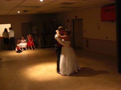 John and Mellisa stealing a kiss during the first dance
