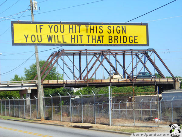 Funny sign that says if you hit this sign you will hit that bridge