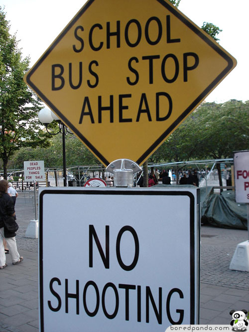 Funny sign that says school bus stop ahead no shooting