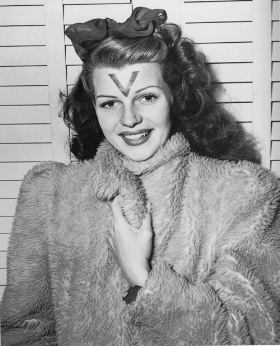 Rita Hayworth sports a V for victory supporting the troops during WW2