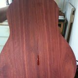 The bloodwood back of a classical guitar in progress.