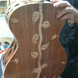 The back of the vine guitar.  That maple isn't an inlay, its a 3-piece back (black acacia &amp; maple).
