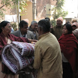 Sumathy aunty distributing blanket and biscuit