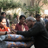 Deepthi ji distributing blanket and biscuit