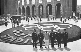 WITH 105,000 SPECTATORS SEATED FOR THE OPENING CEREMONY, QUIET REIGNS ON THE OUTSIDE OF THE STADlUM MEMBERS OF THE TRAFFIC COMMITTEE IN THE FOREGROUND TRAFFIC COMMITTEE