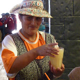 Getting a healthy serving of home brewed chicha. Yum ! Not..