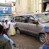 Cars being "blessed" by various priests, witches etc while liberal amounts of beer are sprayed over them.