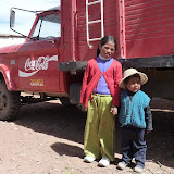 Local kids posing in front of an old Coca-Cola truck
