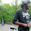 Shawn stops on the pedestrian bridge over the Erie Canal