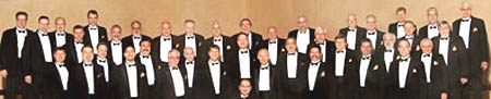 Group photo of Thoroughbred Chorus in tuxedos