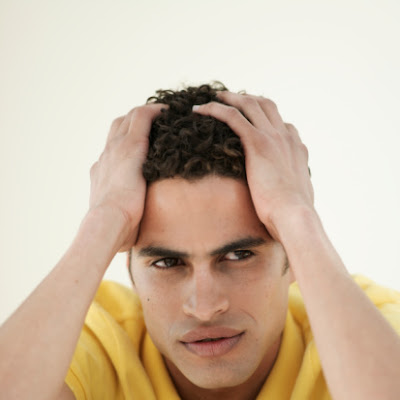 We put the "easy" in easy payday loans! A worried, stressed man with his hands on his head.