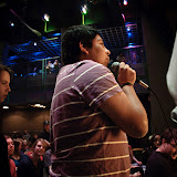 Richard, a student, asks a question to the speakers.