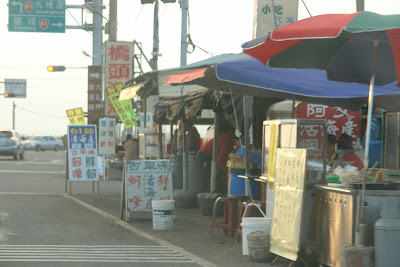Turn right and you are onto Route 61, northbound. The stalls sell sea food and oyster snack.
