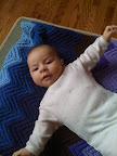 Stretching out on the floor. She does love to have those limbs free.