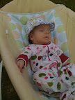 Audrey is sunbathing...but not really. It was pretty cloudy that day. I did manage to find a hat that would fit her head.