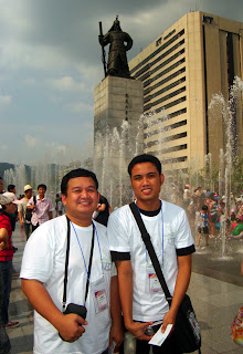 Day 3 (2:00 pm) - Sir Ervin and Sir Jerome pose in front of famous Korean national warrior hero in the middle of Seoul City.