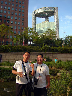Day 3 (4:00 pm) - Sirs Jerome and Ervin pose in front of unique UFO shaped Korean building.