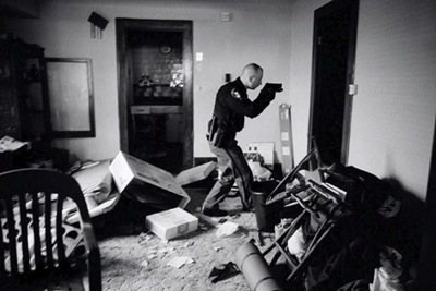 This picture by US photographer Anthony Suau, for Time won the World Press Photo of the Year 2008 award, it was announced by the organisers on 13 February 2009 in Amsterdam, The Netherlands. US Economy in Crisis: Following eviction, Detective Robert Kole must ensure residents have moved out of their home in Cleveland, Ohio, 26 March 2008.
