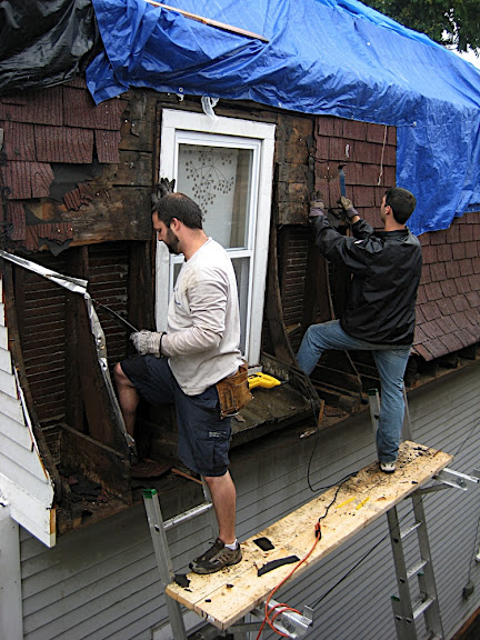 Peeling off the Mansard hip shingles and sheating