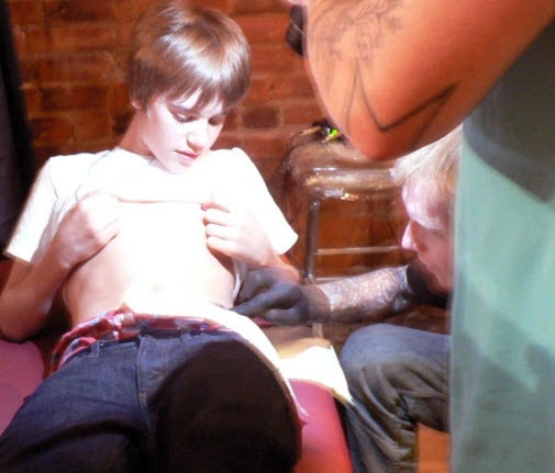 justin bieber family photos. This Justin Bieber tattoo
