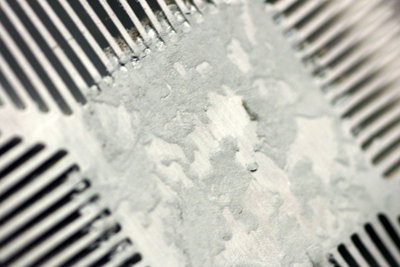 Dried up thermal grease on processor cooling fan