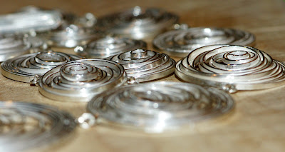 Side angle of Swirling Schools necklace