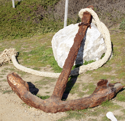 Classic shape of a rusty old anchor