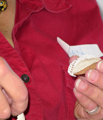 Susan assembles a fine silver bead using greenware lace