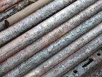 Sulfur quickly attacks the iron rods, in which the hard rubber rods are being vulcanized.