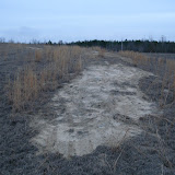 A typical closed landfill requires continuous maintenance. Here bare areas are photographed and reseeding is recommended to the owner.