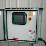 A custom-built remediation system for a gas station showing system shutdown control and data readout panel.