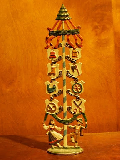 Spring Tree dance around a spring tree with craft signs of the active guilds in a Capsen village