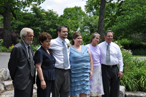 The parents and the couple pose.