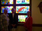 Bill and Anita Luff and Barbara Fox and the stained glass windows.