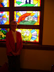 Barbara Fox and "The Crucifixion" stained glass window.