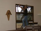 Amanda Early preparing the west side windows for installation of the stained glass.