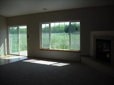 From the hallway, looking at the Great Room and view from back windows/slider