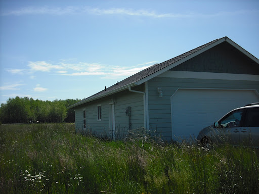 Looking at the side of the house from the lane
