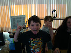 He is not throwing the horns, its the Fernley Elm. School “Wolf” sign.
